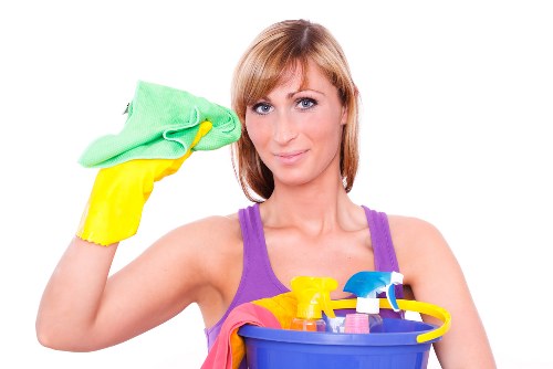 Domestic cleaner in a Kingston home working in a kitchen area