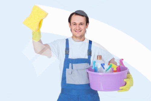 Airbnb cleaner preparing a guest-ready living room in Kingston