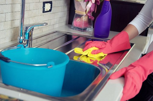 Cleaner preparing tools for a carpet cleaning appointment