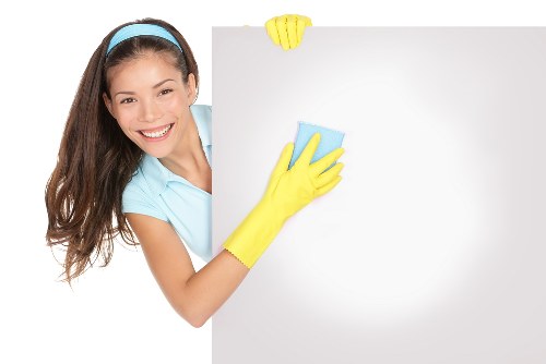 Local cleaners working in a Kingston townhouse during move-out cleaning