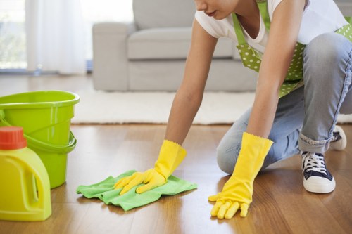 Professional cleaners restoring a well-used carpet area
